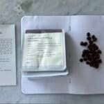 Rich coffee beans, coffee tasting notes, and a coffee bean package for Argopuro Purple Berries coffee from Bali, Indonesia. Showcases premium coffee tasting experience and high-quality bean selection.