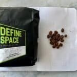 Bag of specialty coffee beans with "Define Space" label from Barnaby Robson, showcasing fresh roasted coffee, ideal for manual brewing and appreciated by coffee enthusiasts.