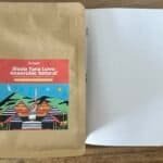 Vibrant illustration of anaerobic natural apple and blood orange fruit seeds on a compostable seed packet. Ideal for sustainable gardening and organic planting projects.